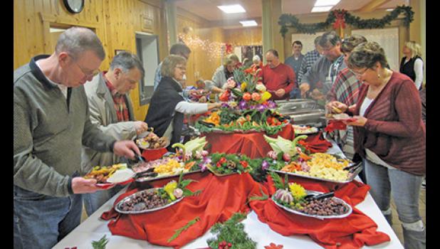 CAMP FRIENDSHIP’S HOLIDAY FUNDRAISING PARTY was filled with numerous hors ‘d oeuvres and sweet treats for guests to enjoy. (Photo by Penny Leuthard)