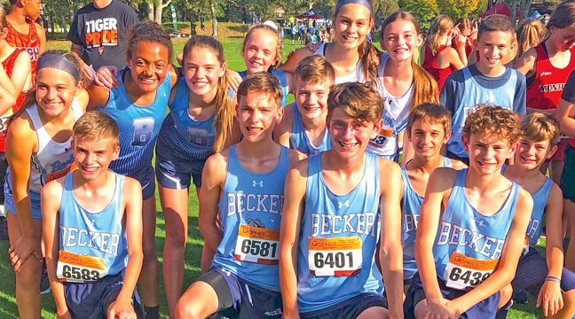 The Junior High boys and girls squads gathered at  the line before the start of the race on their home course  last Tuesday. (Submitted Photo).