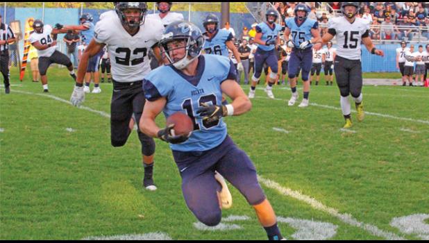 TAILBACK MORGAN BOROS caught this short pass and gained good ground after the catch early in the game. 