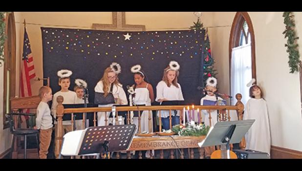 STAR SEARCH. Snake River Free Mission Church Sunday School shared the Christmas story through their musical production last weekend during the Sunday morning worship service. Each child received a goodie bag with peanuts in the shell, hard candy and apple after the pageant, reminiscent of a bygone era. Pictured: Austin Hoeft, Hunter Hoeft, James Erickson, Kaylee Erickson, Jaleahya Penn, Karli Kirk, Jason Wagner and Scarlet Wagner. (Photo by Mary Nehring). 