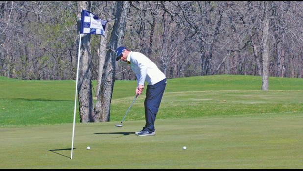 JARED POEPPING of St. Cloud sent this putt towards the hole during Wednesday’s round with some friends. (Photo by Bill Morgan)