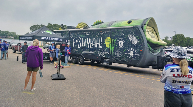 THE BASSMOBILE, sponsored by Fleet Farm, could be seen at the Big Lake Beach during the three-city tournament last week. (Photo by Katherine Cantin.)