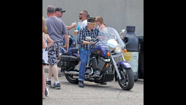 THIS LOCAL VET weaved his way through the crowds on his Harley-Davidson Saturday morning following the parade.