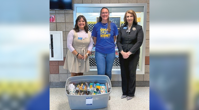 MEMBERS OF MINNCO IN BIG LAKE Melissa Schaefer (L) and  Nancy Frerich (R) showed off their bin of supplies with a Big Lake employee (middle).  (Submitted Photo).