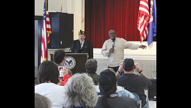Guest speaker Thomas Miller (right) addresses the crowd during the Veterans Day Ceremony at St. Cloud VA Medical Center Tuesday as St. Cloud Area METROVETS President Ken Johnstone looks on. (Photo by Ken Francis.)