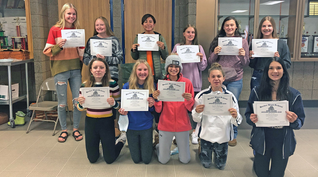 BULLDOG CROSS COUNTRY RUNNERS posed with their participation certificates they received at Tuesday’s end-of-the-season banquet. (Submitted Photo).