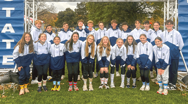 Both the boys and girls cross country teams are posing in front of the state finish line, where the boys placed fourth and the girls placed ninth. (Submitted Photo).