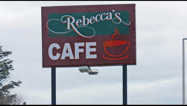 A NEW SIGN is on the Becker horizon as Rebecca’s Cafe opens for business in the old Coffee Cup location along 1st Street. (Photo by Bill Morgan)