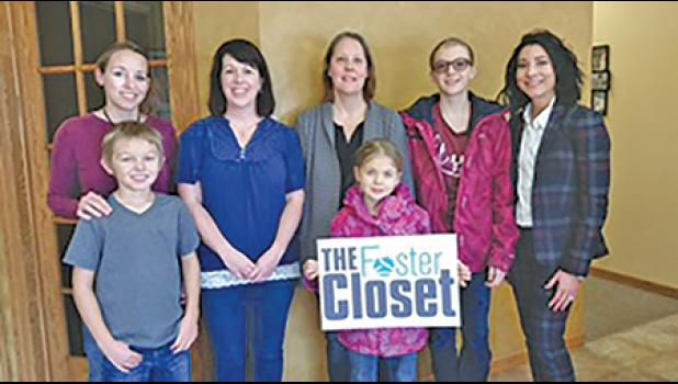 AMY CHMIELEWSKI (far right) posed with members of the Foster Closet at her offices Wednesday. (Submitted Photo).