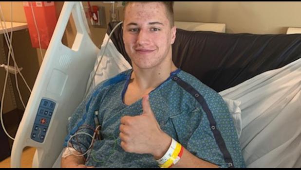 BRAYDEN WEBER gives a thumbs up from his hospital bed at Children’ Hospital. (Submitted Photo)