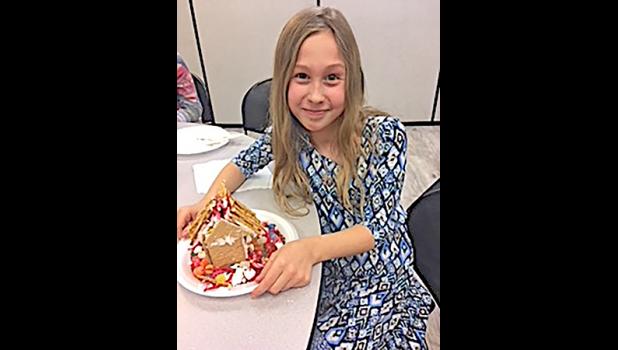 CHARLOTTE GALLAGHER attended the Becker Library’s gingerbread making program for an afternoon of holiday fun. (Submitted Photo)