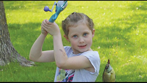 Audra Hagen with a 2 3/8 ounce sunfish, still on the line.