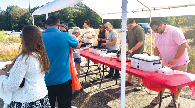 Guests lineD up to sample and vote on their favorite chili at the Sherburne Fall Fest. (Patriot Photo by Andrew Diemand.)