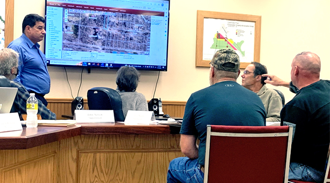 PATRICK CHAPLIN AND ATTY. JOHN PETERSON explain the issues Chaplin’s come up against while attempting to get 157 ½ Street back to where it’s supposed to be during Clearwater Twp.’s November meeting. (Photo by Penny Leuthard.)