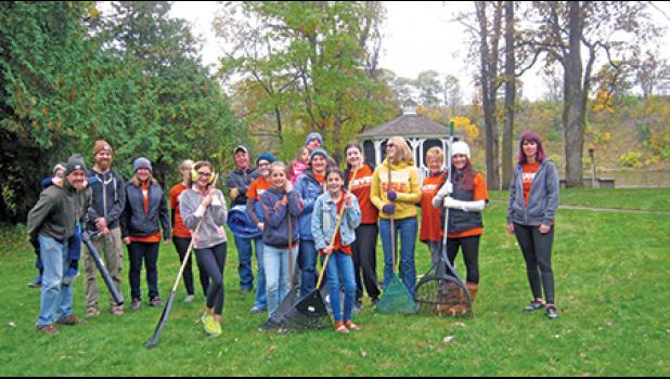 River of Life Church volunteers doing yard work for one of the Faith in Action clients earlier this fall (Submitted Photo)