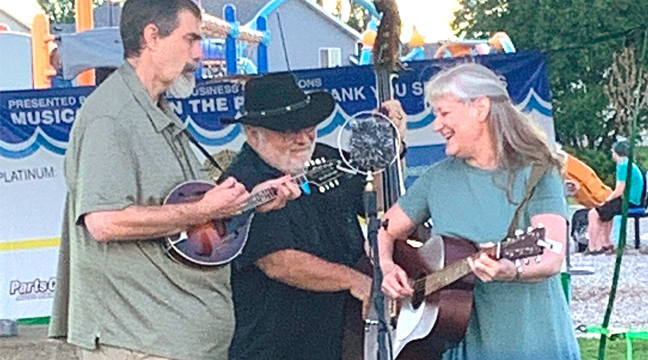 BLUEGRASS BAND Singleton Street entertained the crowd for the last Music in the Park concert August 25. (Photo by Penny Leuthard.)
