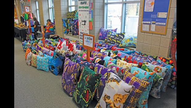 ONE VENDOR had a floor full of jumbo and large pillows uniquely made in sports team fabrics as well as cartoon characters and animal prints. 