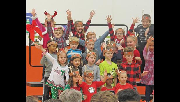 CLEARVIEW KINDERGARTEN STUDENTS (below) finish the song Reindeer Pokey with a flourish during their winter concert Thursday afternoon.