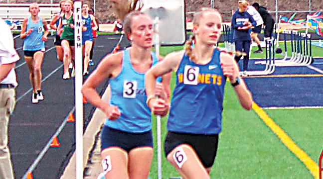 Greta Layton  holds off Alexis Rose of Becker during the final lap to finish fifth in the 1600 meters. (Photo by Ken Francis)