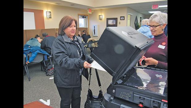 Linda Kay Helgeson places her vote at Clear Lake City Hall Tuesday. (Photo by Penny Leuthard)