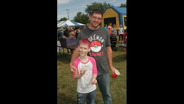 David & James Green are having fun at Mary of the Visitation's block party.
