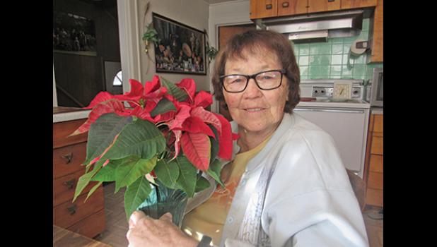 CLEARWATER RESIDENT MARY KESKE remembers stringing popcorn for the family Christmas tree growing up. (Photo by Penny Leuthard)