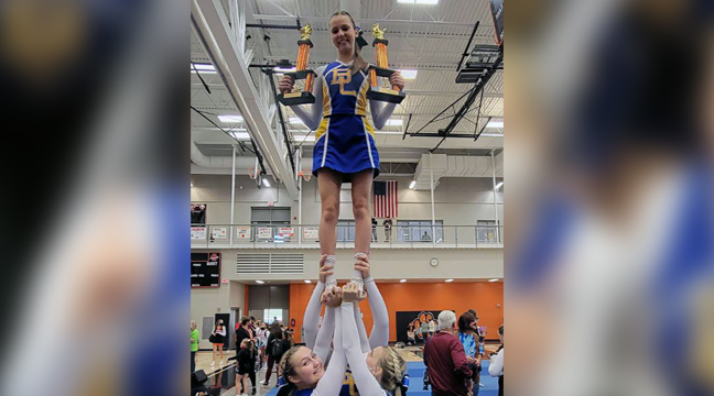 THE BIG LAKE CHEERLEADERS showed off their talent and their trophies in a photo op after thier wins last weekend. (Submitted photo.)