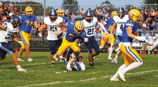 BIG LAKE’S Montell Hester found the going tough against Zimmerman yet accumulated 53 yards on nine carries (averaging nearly six yards a carry) in the Hornets’ loss to the Thunder last Friday night at home. (Submitted Photo by Jessica LaRoche).