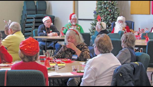 Guests at Thursday’s Young at Heart event enjoyed lunch, carols and a visit from Santa and Mrs. Claus. (Photo by Penny Leuthard)