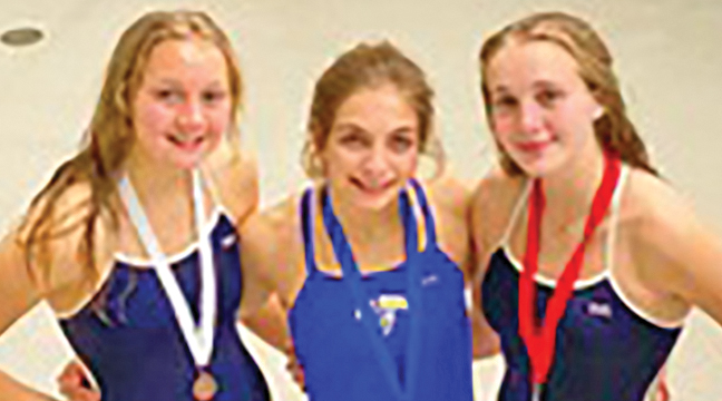 BIG  LAKE’S BRITNEY KRUMREI was flanked by Becker’s Sarah and Lauren Woelfel after Krumrie captured first place at the Becker meet and Sarah took second while Lauren took third. (Submitted Photo)