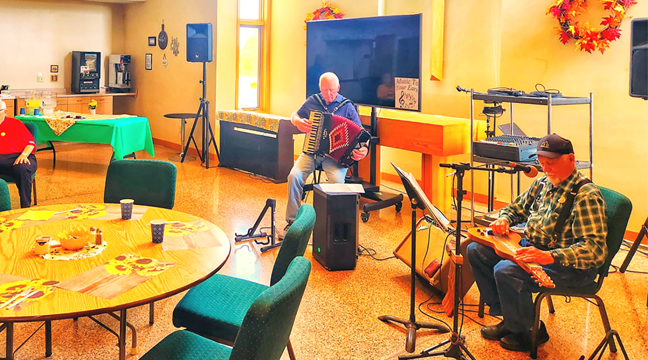 Musicians Travis Kent and Richard eckman provided accordion and steel/lap guitar music for the event. (Photo by Mary Nehring.)