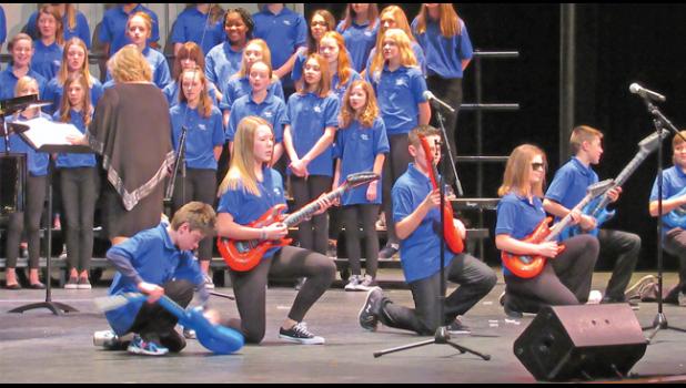 BMS 7TH GRADE CHOIR STUDENTS ‘rock out’ with Jingle Bell Rock during their portion of the winter choir concert this past Thursday.