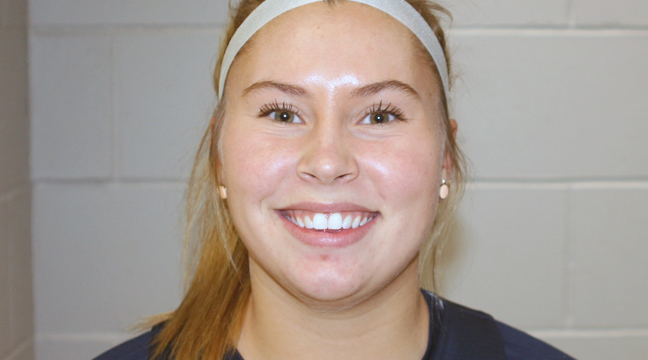 Becker’s Dani Nuest surveys the defense and looks for the passing lane in the first half of the Hwy. 10 border battle Tuesday evening in Becker.  Defending for the Hornets is Mia Huberty, who was recognized in the second half of the game for scoring her 1,000th career point. (Submitted Photo).