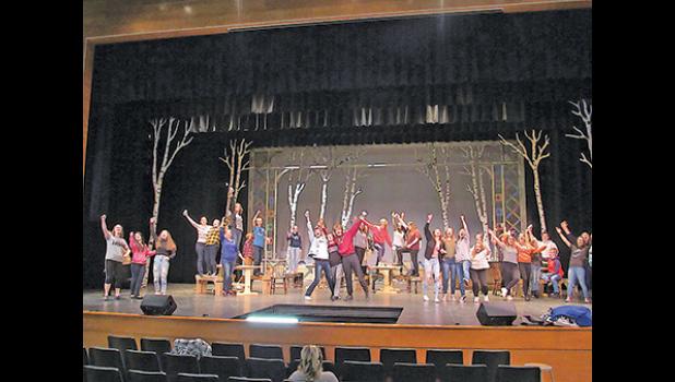 BECKER HIGH SCHOOL STUDENTS finish off a big number during rehearsals for their fall musical, Fiddler on the Roof, a story centering around a Jewish family in 1905 Russia attempting to maintain their religious and cultural traditions.