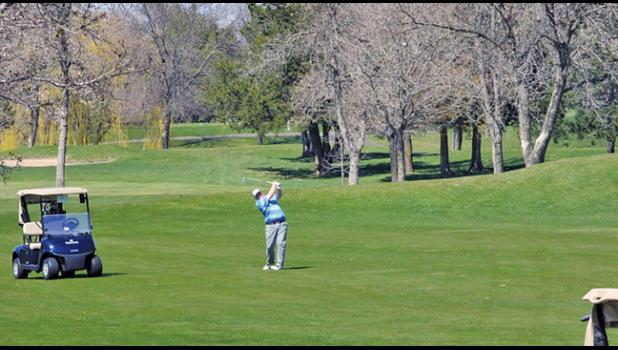 JOSH KUHA from the City of Becker sent this shot to the green during a round Wednesday afternoon at Pebble Creek. (Photo by Bill Morgan)