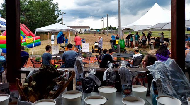 SANTIAGO RESIDENTS (above) attended the Reid benefit held by the Santiago Lions last weekend. In the foreground sit prizes for raffle tickets. (Submitted photo.)