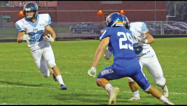 JUNIOR TAILBACK Ethan Wilson scampered around the left side of the line and eluded several tackles while rambling 36 yards down the sideline for Becker’s second score of the game. (Photo by Bill Morgan).
