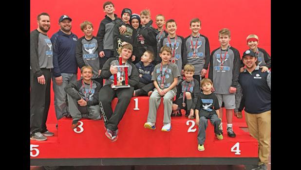 THE BECKER YOUTH WRESTLING TEAM posed for photos with their medals and second place trophy after last weekend’s tournament in Stillwater. 