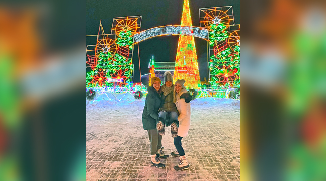 One key to surviving Minnesota winters is to create traditions that embrace the cold weather, like an annual visit to Duluth. Kaitlin, Kelly and Kia enjoy the sights and sounds of Bentleyville  (Photo by Mark Kolbinger.)
