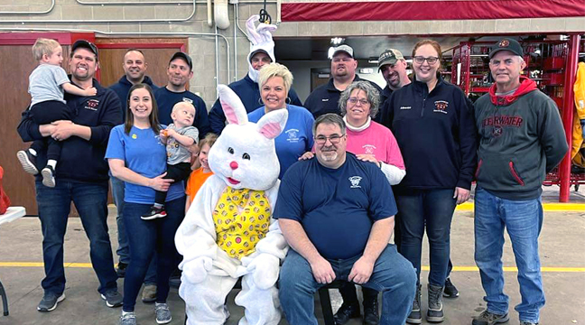 MEMBERS OF THE CLEARWATER FIRE DEPT. and Auxiliary members gathered with the Easter Bunny last Saturday to host an Easter egg hunt for local kids. (Submitted photo.)