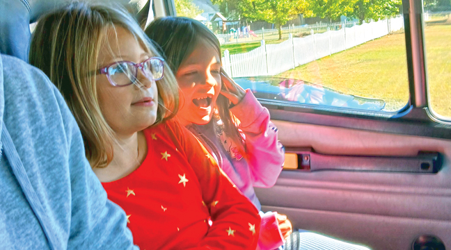 TRUCK RIDES (right photo) is always a main attraction at the Open House as the Haas girls — Aspen and Aria — get excited to take a trip around the block. (Patriot Photo by Deven Haas).