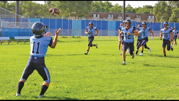 THE BULLDOG FOOTBALL TEAM ran through punting drills Thursday morning in full uniform (minus shoulder pads). The team was dressed to the hilt for their annual team photo scheduled for later that morning.