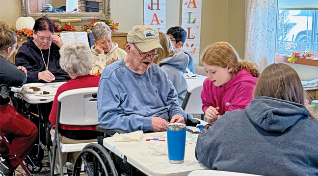 HARVEST CHURCH VOLUNTEERS aided Cherrywood Nursing Home residents with reading of stories, playing bingo and just plain building relationships. (Submitted Photo).