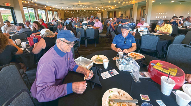 THE BANQUET ROOM was packed as the guests found tables to enjoy drinks and a buffet meal following the day's golf tournament. (Patriot photo by Bill Morgan).