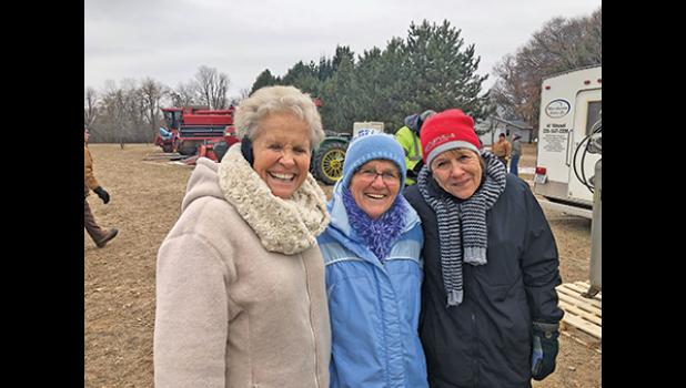 THE OLSON SISTERS (bottom) Rosemary (Olson) Harmsen, Judy (Olson) Knutson and Barb (Olson) Ritze were not daunted by the cold at Rick and Bonnie Olson's outdoor auction near Becker. 