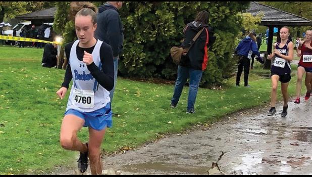 ALEXIS ROSE pushes forward under less than ideal racing conditions during the team’s meet in Alexandria Saturday. (Submitted Photo)