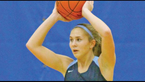 COURTNEY NUEST had a double/double last weekend, scoring 12 points and pulling down 10 boards. (Photo by Bill Morgan)