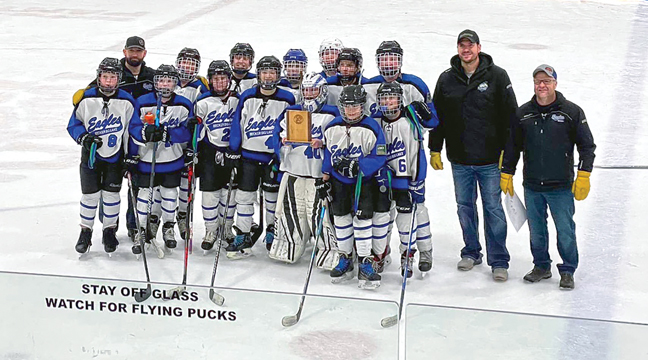 Becker Big Lake Peewee B1 Hockey Team claiming their District 10 tournament trophy. Front row, left to right: Haven Karls, Finnegan Kellogg, Brant Rusin, Titus Borkoski, Max Klassen, Van Dugger and Hunter Heitkamp. Back row, left to right: Coach Brady Borkoski, William Emerson, Ashdon Draeger, Owen Zahler, Edward Lane, Caleb Martin, Jaxon Reiffenberger, Coaches Justin Reiffenberger and Justin Dugger. (Not pictured: Manager Nicole Klassen). (Submitted Photo).