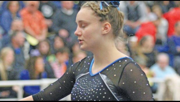 SARAH WOELFEL had the top score for Becker gymnasts on floor last Saturday. She tallied an 8.8. (Photo by Bill Morgan)