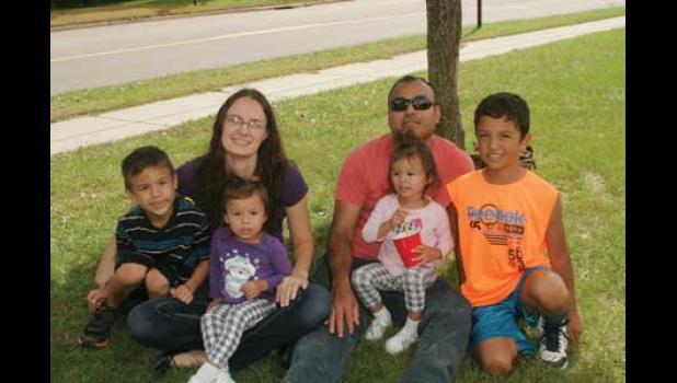 FAMILY TIME. Ramario, Avalie, Amanda, Rosalie, Roberto and Alex take a moment to pose for a photo as they enjoy parish members getting dunked in the dunk tank.